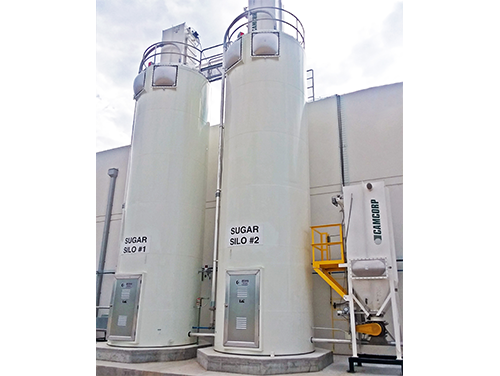 Two sugar bulk storage silos with explosion venting